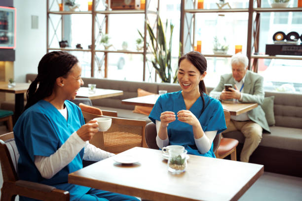 istock Medical workers having coffee break at cafeteria 2097327201