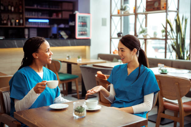 istock Medical workers having coffee break at cafeteria 2097327350