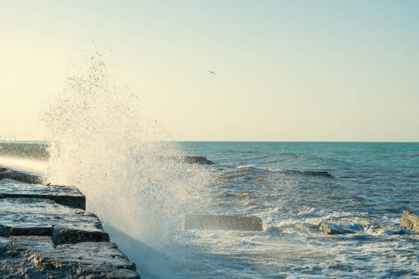 istock Waves crash on the pier. Water splashes, drops, splash. 2097329277