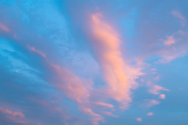 Beautiful sunset in the sky. Pink clouds. Sky background. Heavenly landscape.