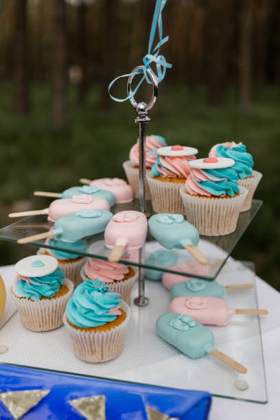 istock Pastel cupcakes and ice cream and popsicles on display for a celebration. 2097332973