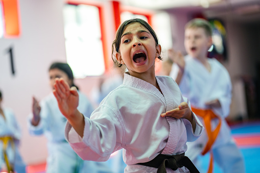 Little  Girl Training During a Karate Class, shouting