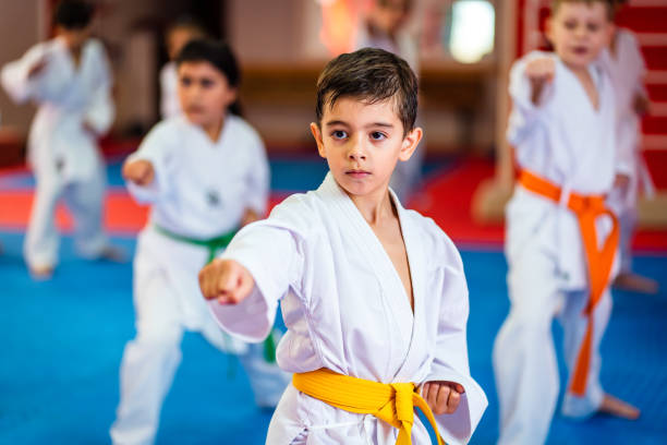 istock Karate training, Kids of different ages in kimono 2097413521