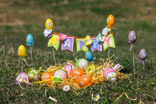 Easter Wreath on Weathered Wood: Colorful Eggs Signaling Spring's Arrival
