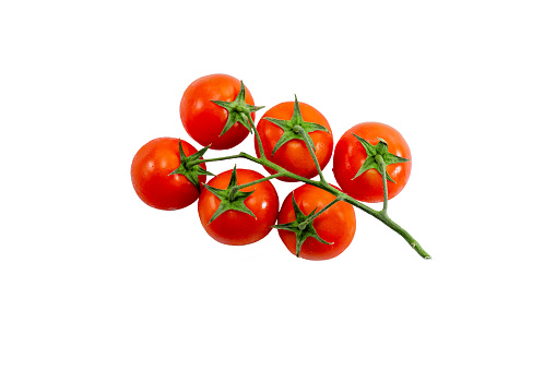 Ripe group of red tomatoes on a branch top view