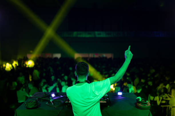 istock DJ gesturing during a performance in a club 2097451060