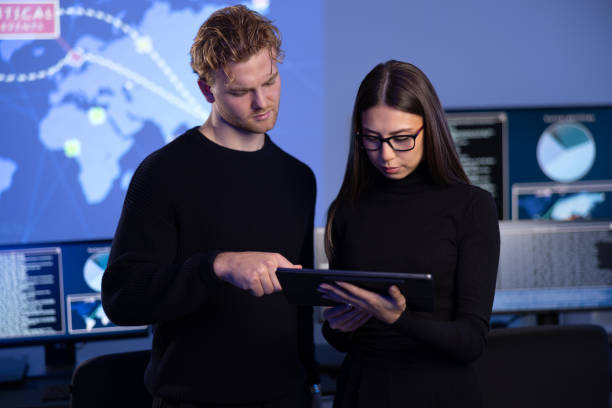 istock Focused professional cyber security team working to prevent security threats, find vulnerability and solve incidents 2097459242