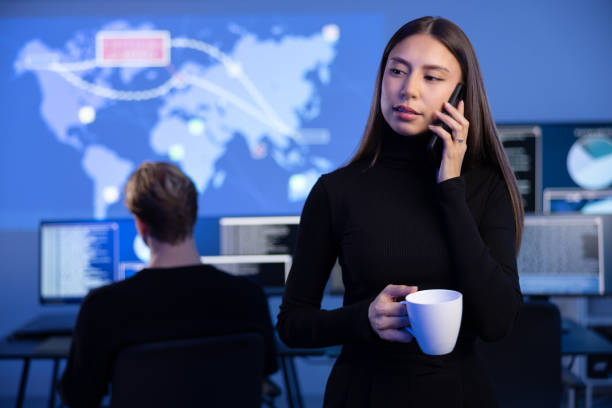 istock Female Cybersecurity Manager talking in the phone in Enterprise Cyber Security Operations Center SOC 2097467483