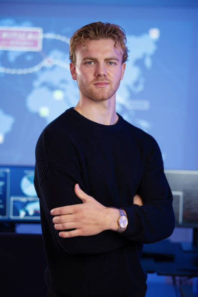 istock Male Cybersecurity Analyst in large Cyber Security Operation Center SOC handling Threats 2097525061