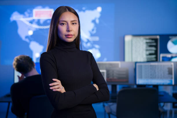istock Female Cybersecurity Analyst or Manager in large Cyber Security Operations Center SOC handling Threats 2097531301