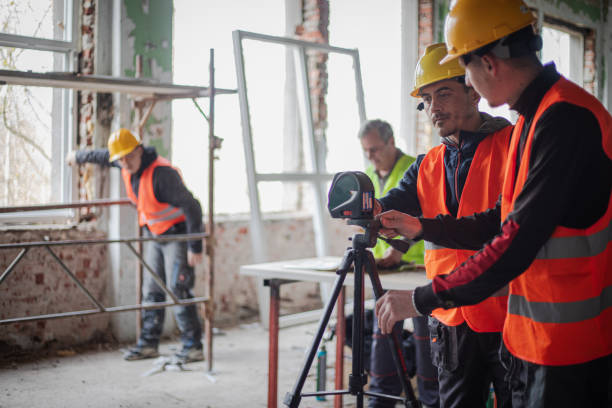 istock Apartment renovation, construction workers install new joinery 2097561311
