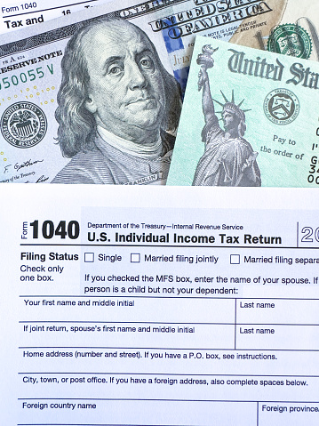 Tax return check on 1040 form background