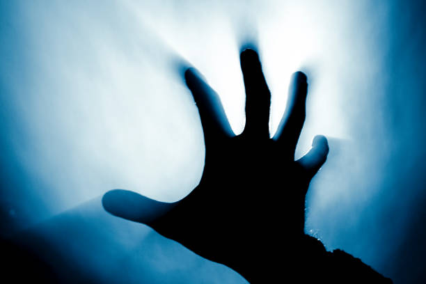 istock blurred hand in smoke in a fire in the harsh light of the sun 2097595106