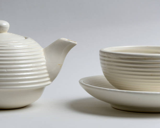 istock white ceramic tea cup and teapot in minimalist style 2097597241