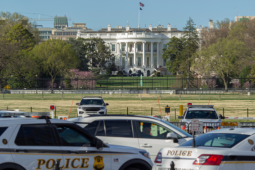 The white house and police cars