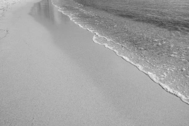 Waves come splashing on the sand beach, sunny, south of France, hot winter, waves, blue