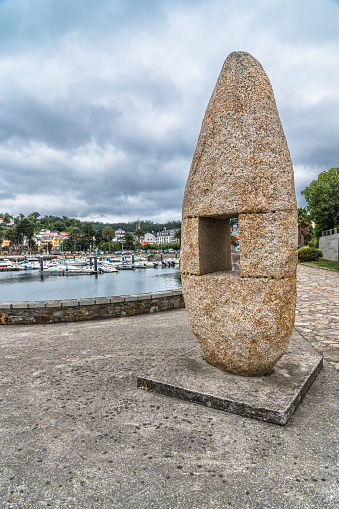 Ortigueira, Spain - August 23, 2022: Stone monolith designed by the sculptor Manuel Paz in the town of Ortigueira, province of A Coruna, Galicia, northwestern Spain