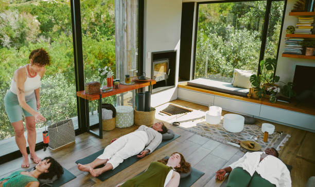 istock Yoga instructor leading a meditation class during a women's wellness retreat 2097660677