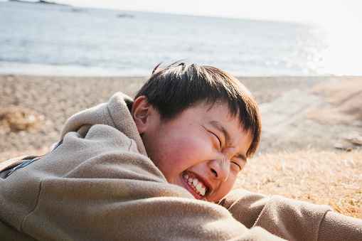 Portrait of Asian boy making funny face.