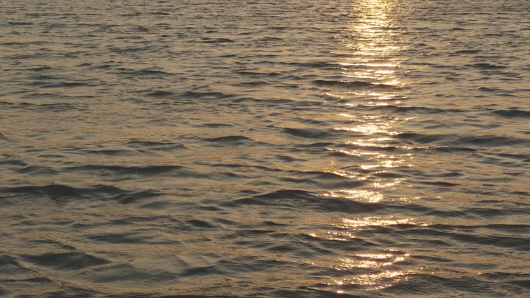 Sunset on Koh Phi Phi with sun reflection on the calm sea