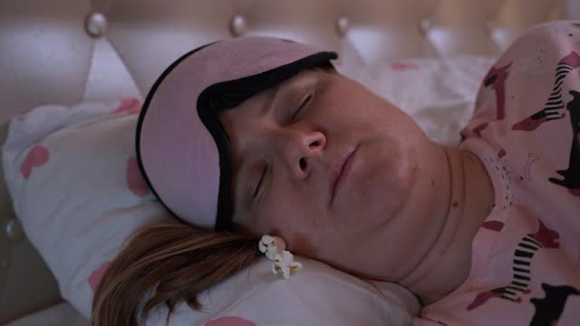 Annoying mosquito, insect prevents woman from sleeping in mask Disturbing dream