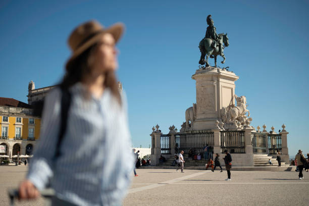 istock City breaks. Woman discovers Lisbon on vacation. 2097738499
