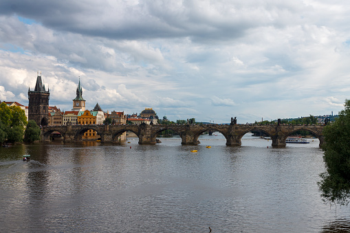 The Charles Bridge (Karluv most), the water clock tower and old town bridge tower over Vitava river, in Prague, Czech Republic.