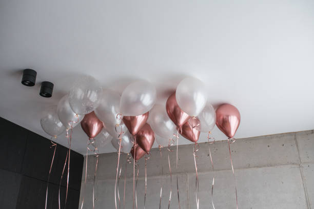 istock Pink and White Balloon Decorations Adorn Hotel Bedroom Ceiling 2097756079