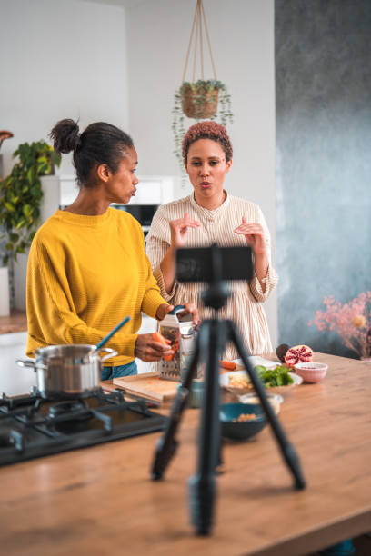 istock Beautiful Female Friends Creating a Wholesome Cooking Vlog 2097759321