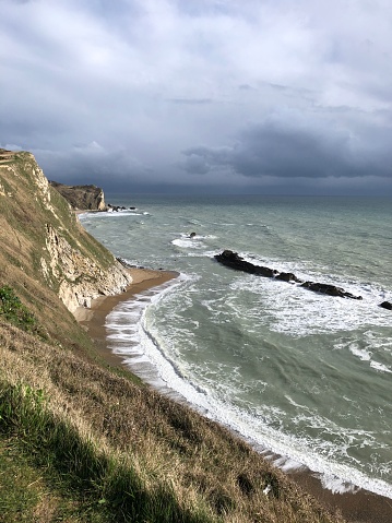 Rocks and sea at Man O'War Cove off the Dorset coast, in March, Dorset, England, United Kingdom