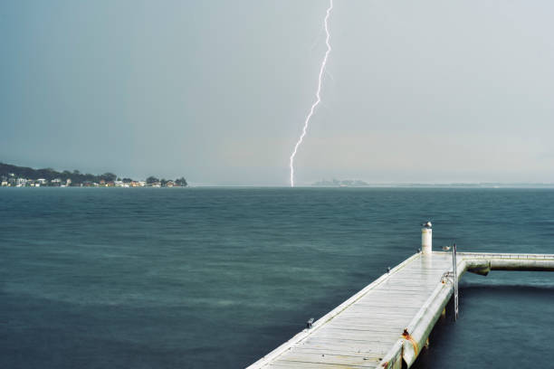 istock Storm over the lake with Lightning 2097782726