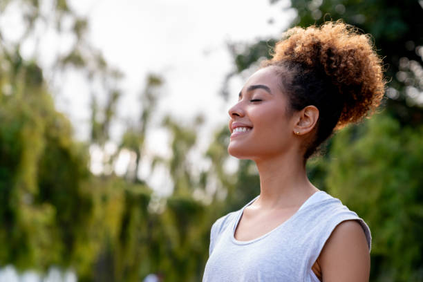 istock Healthy woman relaxing outdoors at the park 2097798655