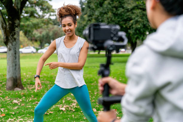 istock Athletic woman making a fitness class tutorial at the park 2097798683