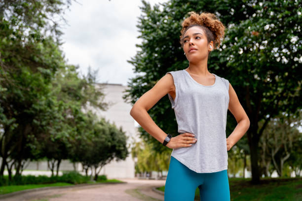 istock Female runner taking a break while exercising at the park 2097798684
