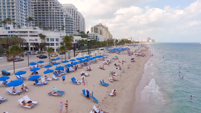 Fast beach flyover aerial Fort Lauderdale Spring Break drone 4k