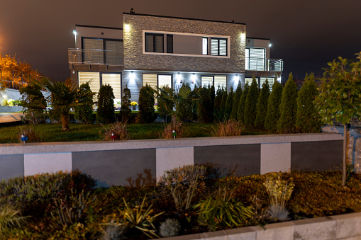 Modern family villa at night