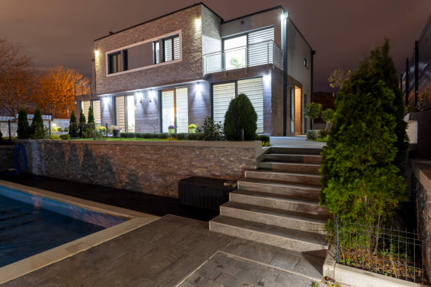 Wooden deck and patio of family home at night.