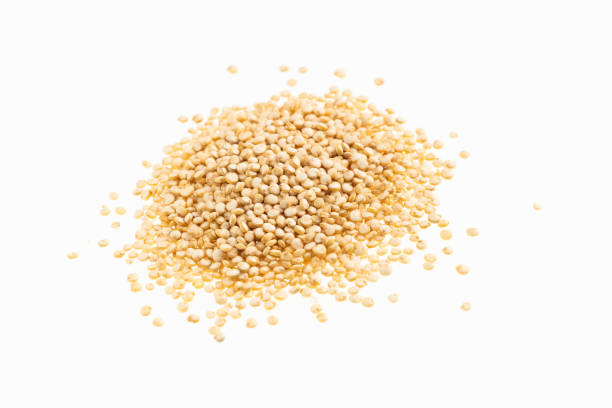 Heap of white quinoa on white background - Chenopodium quinoa
