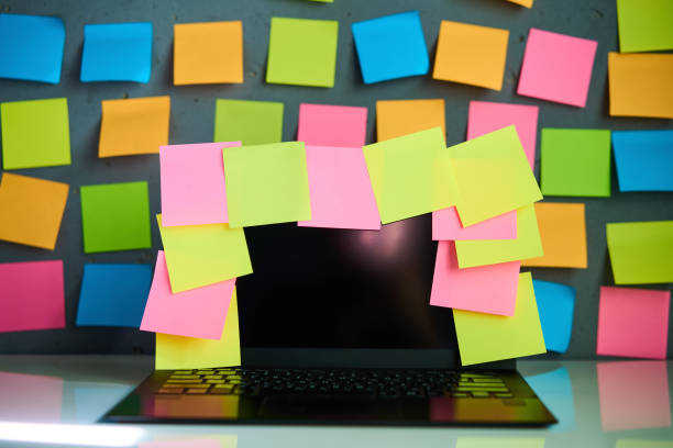 istock Office workplace with laptop and blank colorful sticky notes reminders 2097857745
