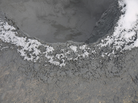 Active mudpot with rising steam on Baranovsky volcano on Iturup, Kuril islands