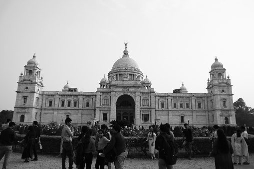 Kolkata, West Bengal, India - March 17, 2024:  People taking selfies in front of the monument