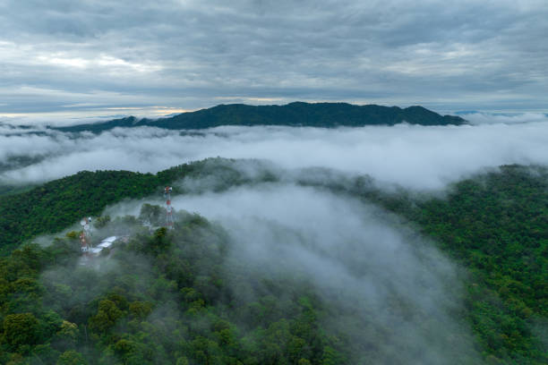 istock High mountain scenery, misted in the morning. 2097973882