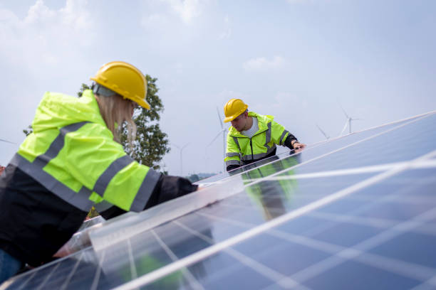 istock Engineers working inspect and check solar cell panel energy is smart grid ecology energy sunlight alternative power with wind turbine farms rotation to generate electricity. 2097979047