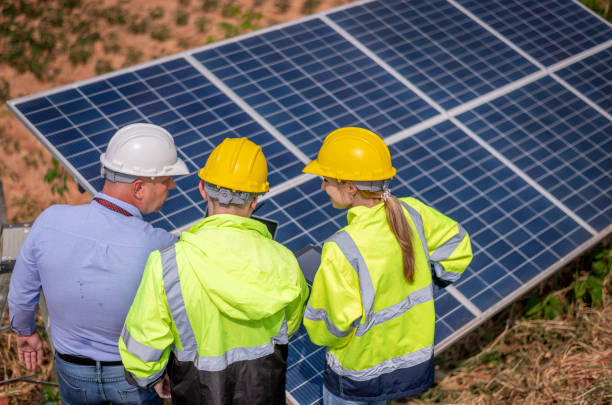 istock Engineers working inspect and check solar cell panel energy is smart grid ecology energy sunlight alternative power with wind turbine farms rotation to generate electricity. 2097979572