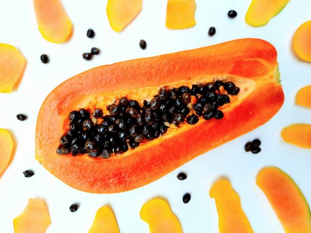 istock Peeling and Cutting Papaya Fruit - white background. 2097992377