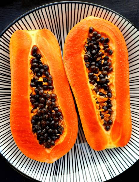 Papaya Fruit and Seeds on plate.
