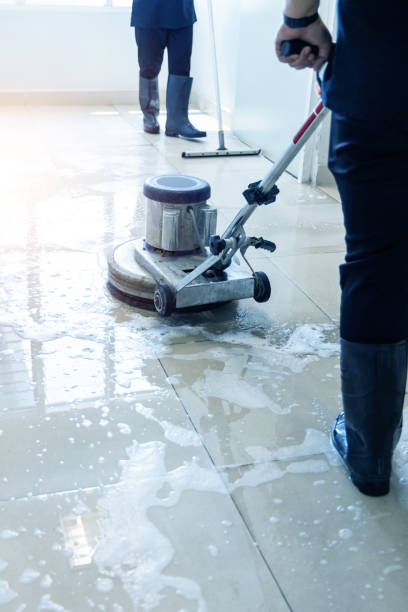 istock Janitor use floor scrubber machine on the floor hallway office building or walkway after school and classroom work job with sun light background. 2098028613