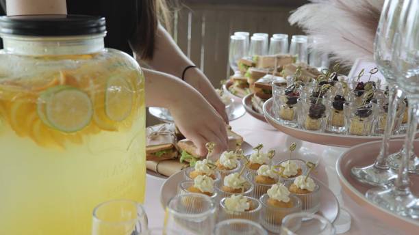 istock Snacks on the table, catering concept. Catering, catering business. Beautiful table setting in the restaurant, buffet. Preparation for the holiday, table setting by the waiter. 2098045686
