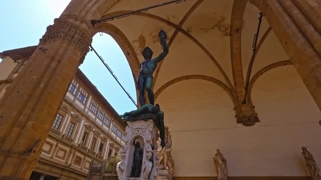 Bronze statue of Perseus with the head of medusa in Florence, Italy, under Loggia dei Lanzi