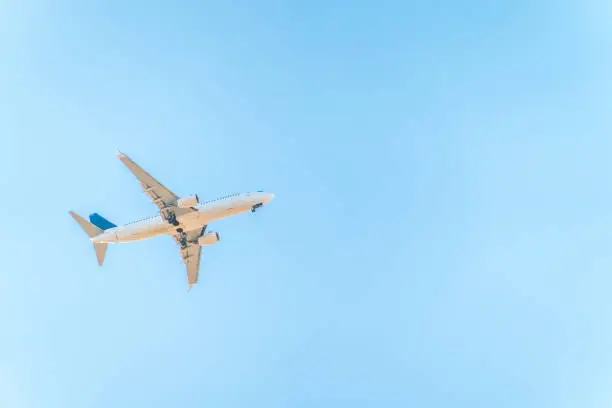 Airplane before landing in blue sky, Boeing 737-800. Air Transport. Tourism and travel concept.